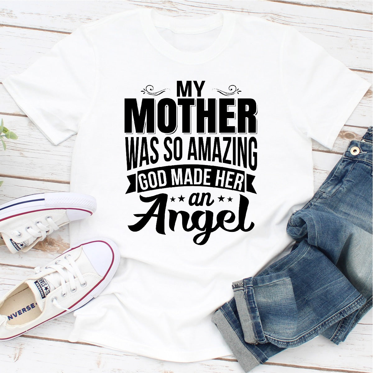 A soft, durable t-shirt featuring the phrase 'My Mother Was So Amazing God Made Her An Angel' in elegant print, perfect for honoring mothers.