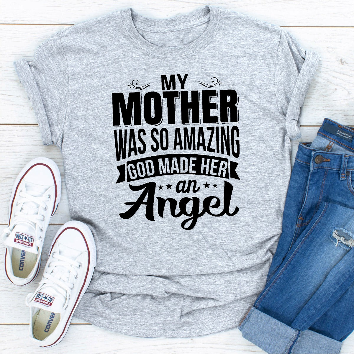 A soft, durable t-shirt featuring the phrase 'My Mother Was So Amazing God Made Her An Angel' in elegant print, perfect for honoring mothers.