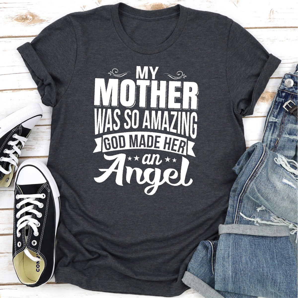 A soft, durable t-shirt featuring the phrase 'My Mother Was So Amazing God Made Her An Angel' in elegant print, perfect for honoring mothers.