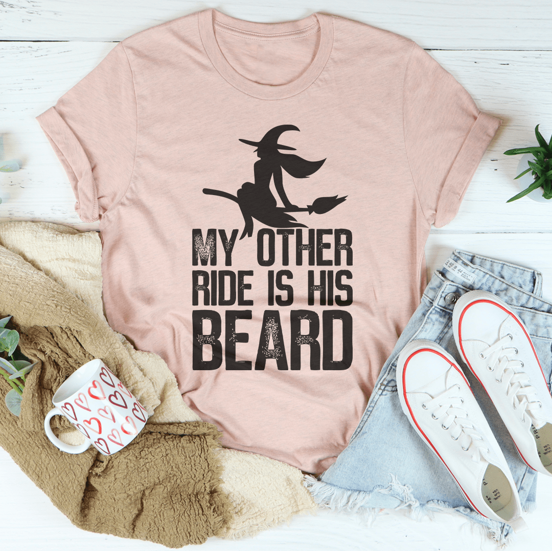 A humorous t-shirt featuring the phrase 'My Other Ride Is His Beard', made from soft cotton with double stitching for durability.