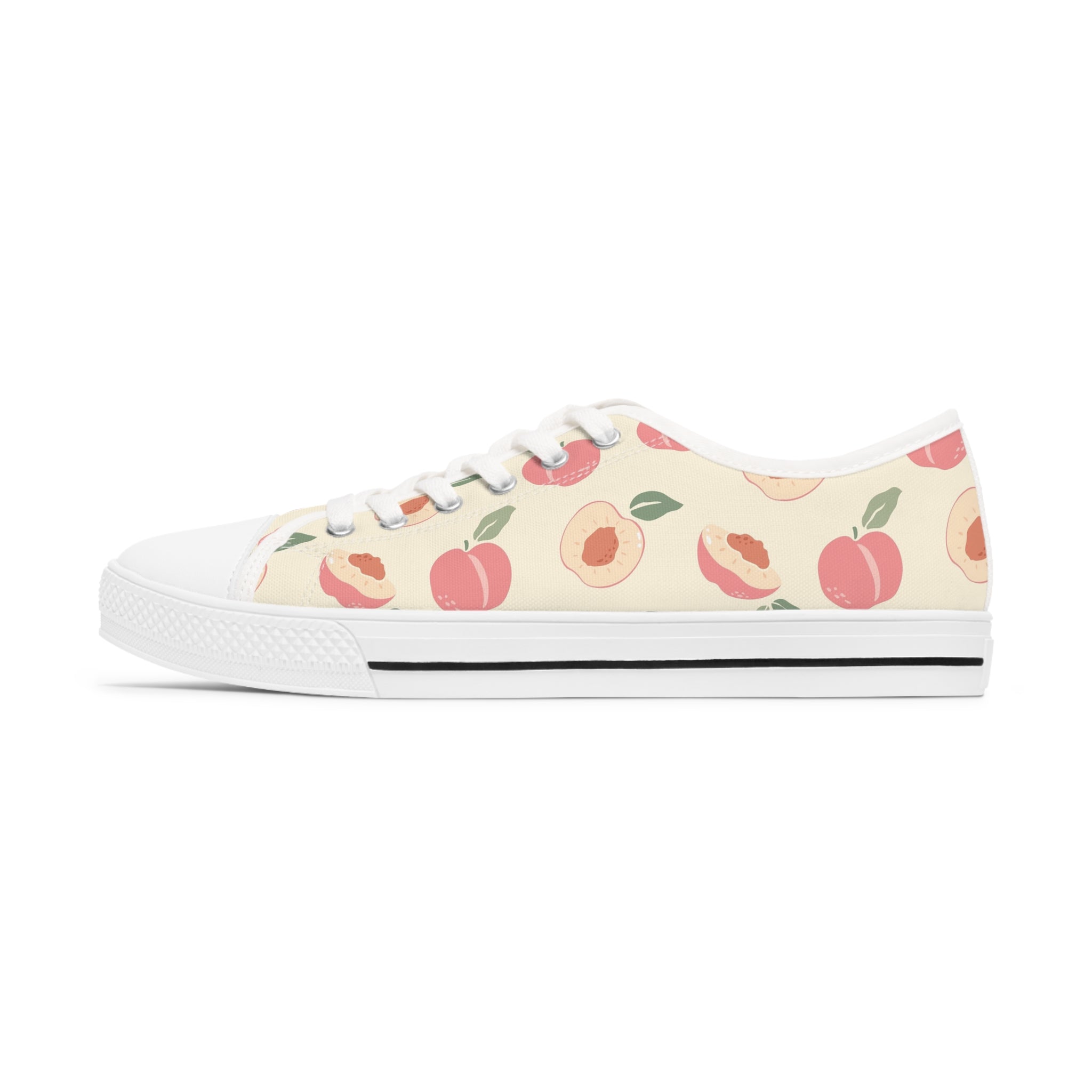 Nectarine Women's Low Top Sneakers in black and white with lace-up closure and silver metal eyelets, showcasing breathable canvas material.