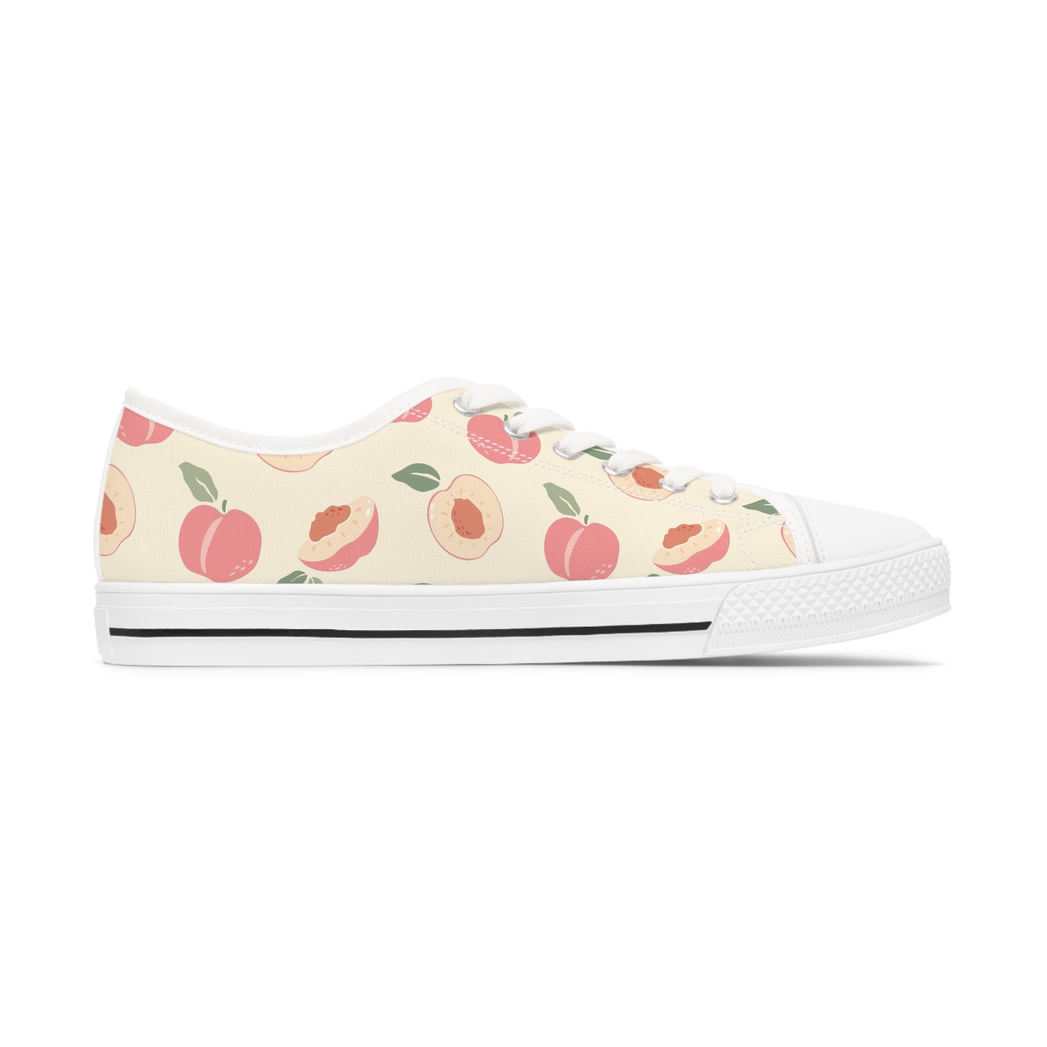 Nectarine Women's Low Top Sneakers in black and white with lace-up closure and silver metal eyelets, showcasing breathable canvas material.