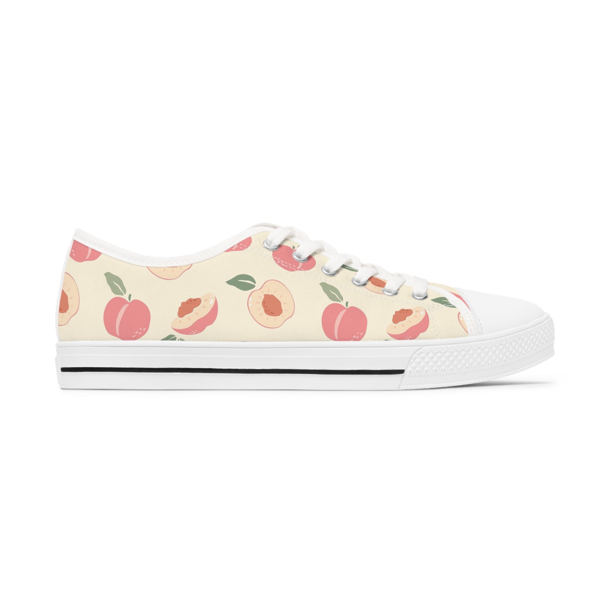 Nectarine Women's Low Top Sneakers in black and white with lace-up closure and silver metal eyelets, showcasing breathable canvas material.