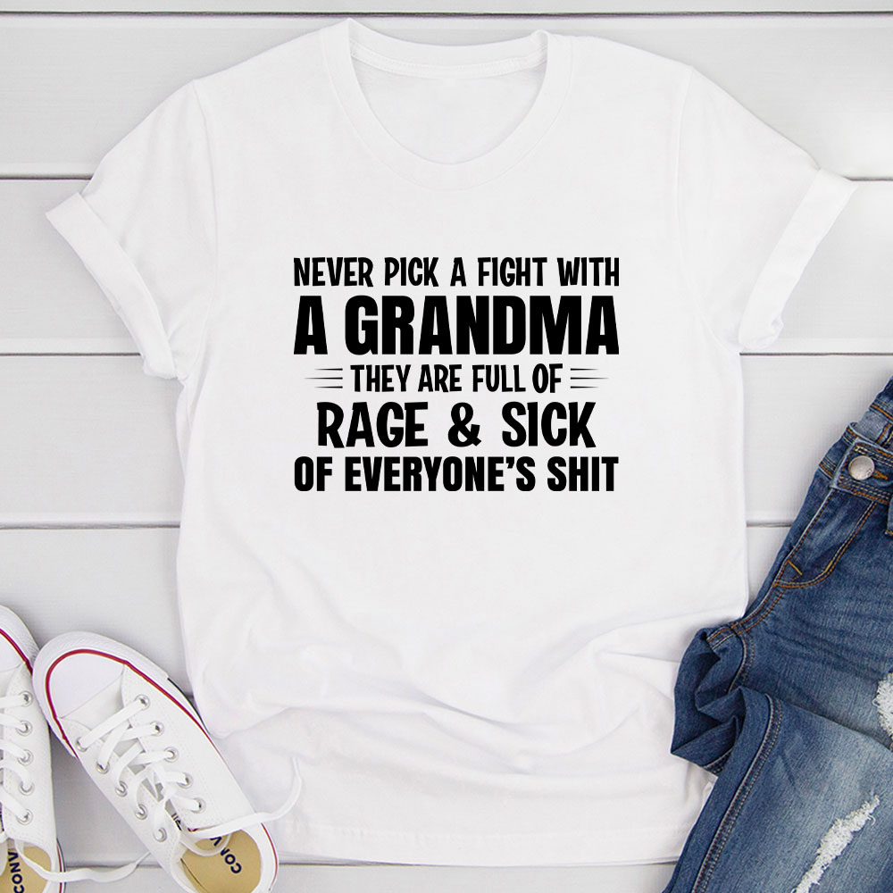 A humorous t-shirt featuring the phrase 'Never Pick A Fight With A Grandma', made from soft cotton with double stitching for durability.