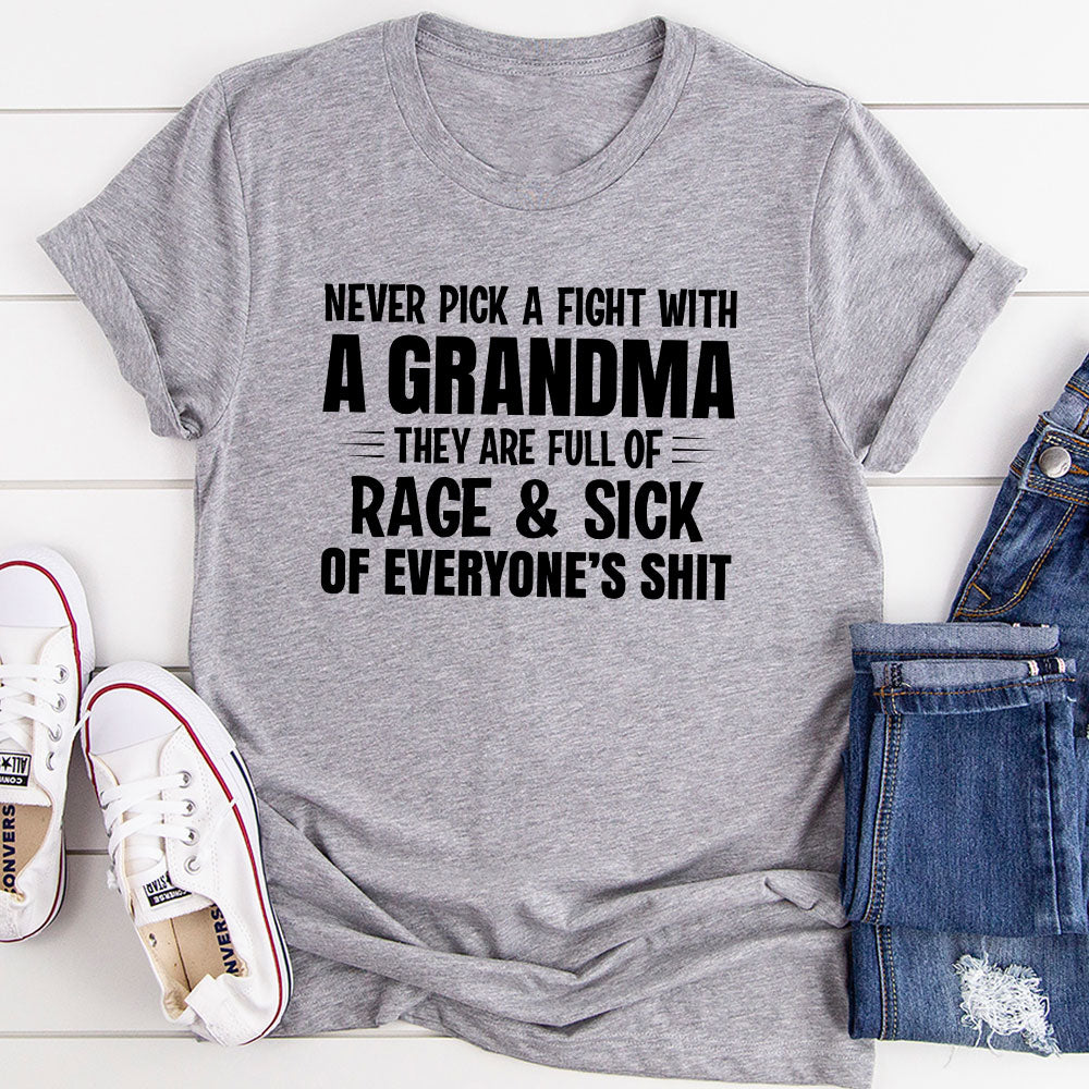 A humorous t-shirt featuring the phrase 'Never Pick A Fight With A Grandma', made from soft cotton with double stitching for durability.