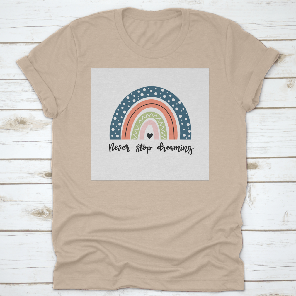 A colorful baby shirt featuring a rainbow design with the text 'Never Stop Dreaming' and 'Be Positive', made from soft cotton fabric.