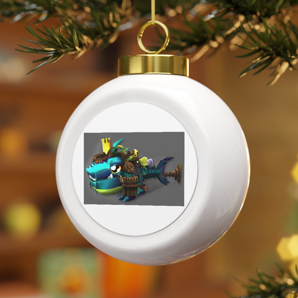 A 3-inch glossy Christmas ball ornament featuring Nibblers the Misfit Shark, adorned with a gold ribbon for hanging.