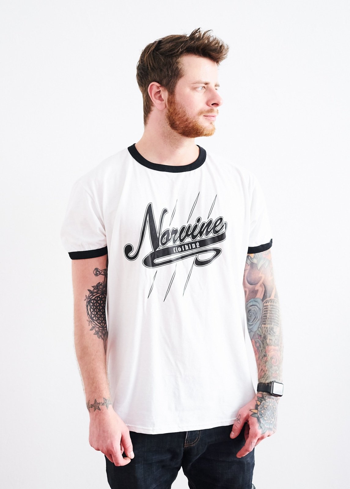 Norvine Campus Retro Ringer Tee featuring black stripes on a white organic cotton fabric, showcasing the Norvine logo on the back.