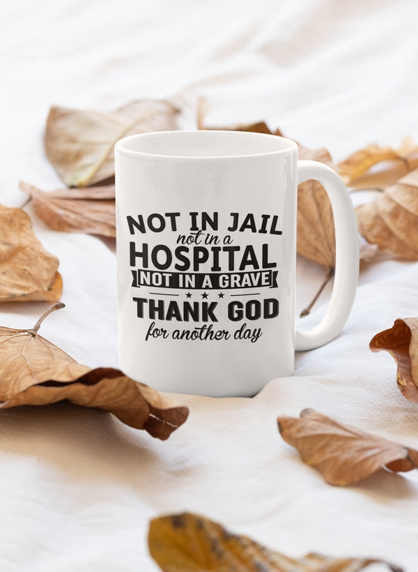 A stylish 11oz ceramic mug with a humorous design that reads 'Not In Jail Not In A Hospital Not In A Grave', featuring a glossy finish and sturdy handle.