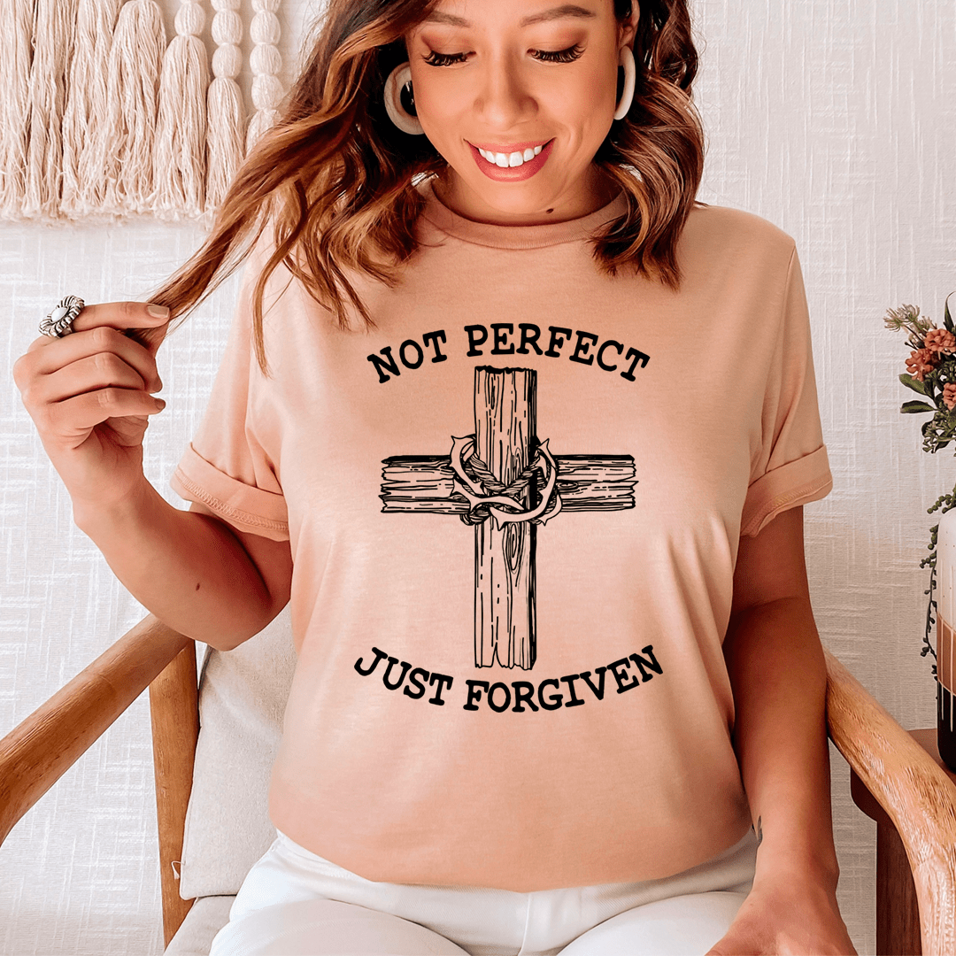 Not Perfect Just Forgiven T-Shirt displayed on a mannequin, showcasing its soft cotton fabric and double-stitched neckline.