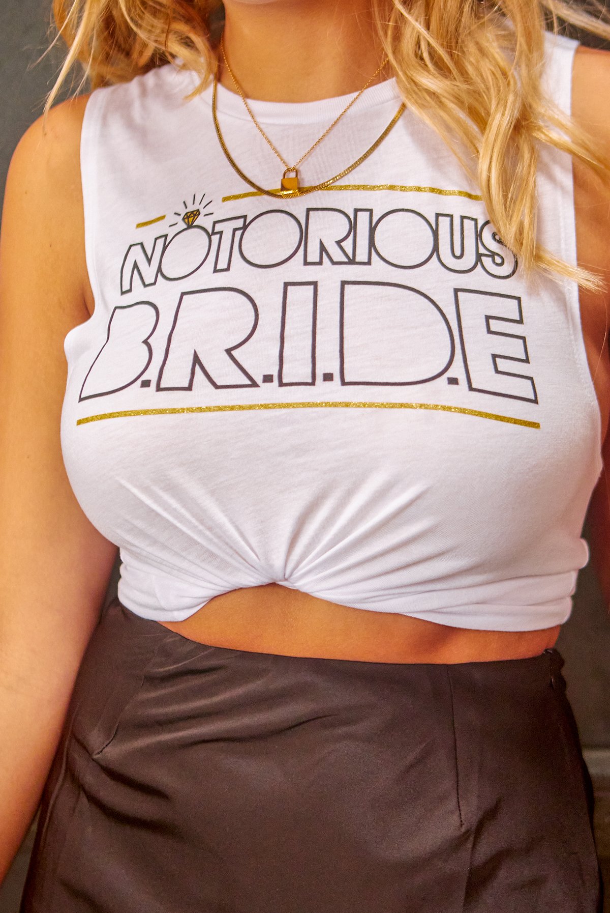 White and black muscle tank tops with 'Notorious Bride' and 'Big Poppa' printed designs, perfect for a bachelorette party.