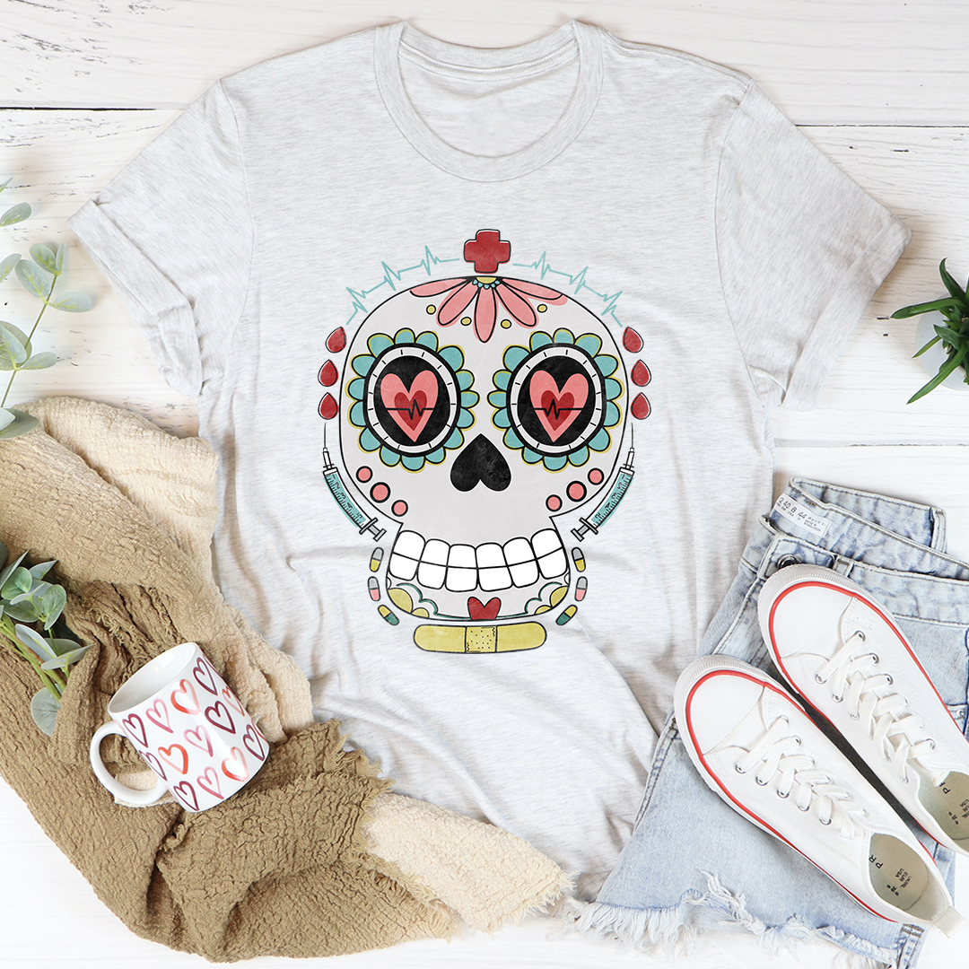 Nurse Sugar Skull T-Shirt featuring vibrant sugar skull design on soft cotton fabric, perfect for nurses and art lovers.