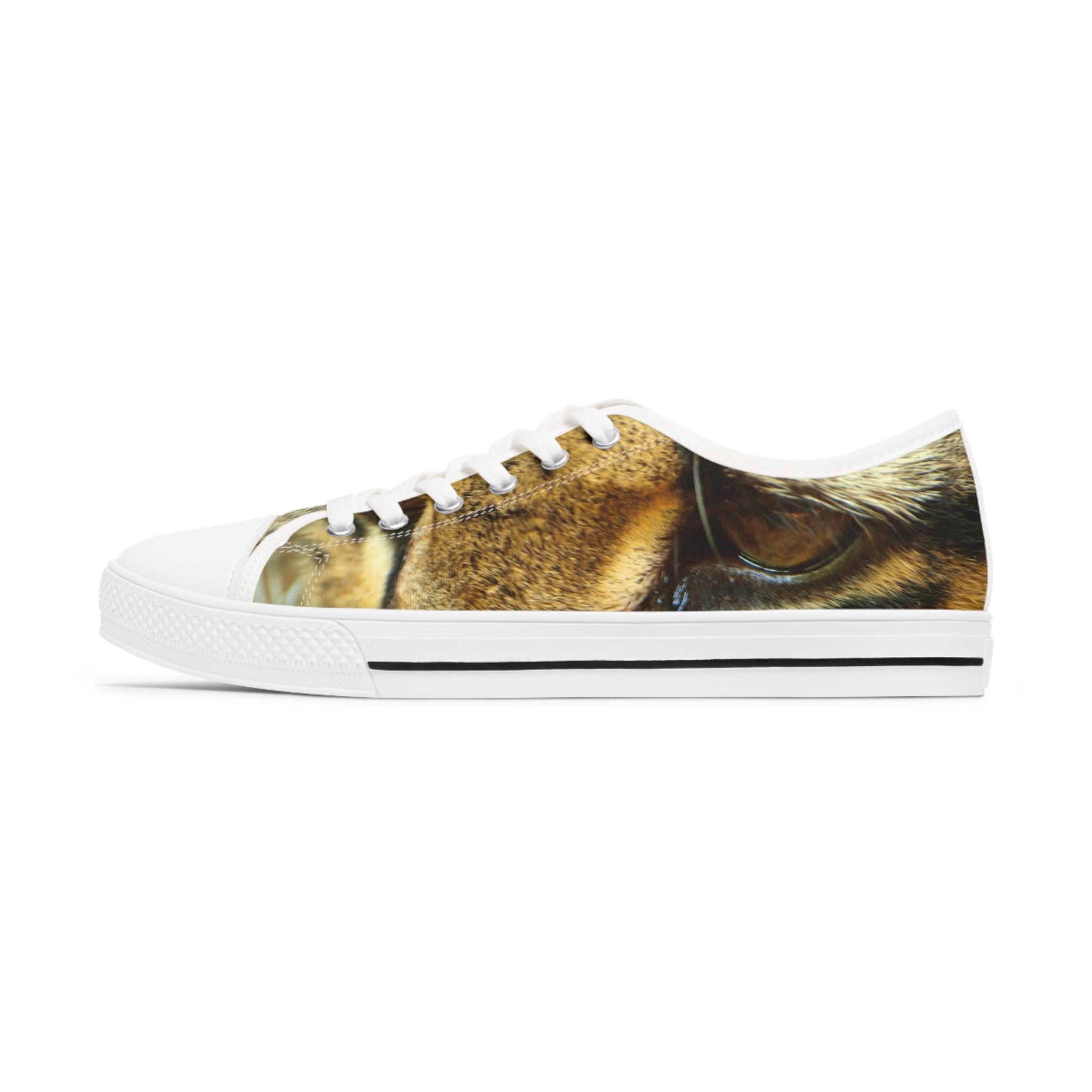 Ocelot Women's Low Top Sneakers in black and white with silver metal eyelets, showcasing breathable canvas and stylish design.