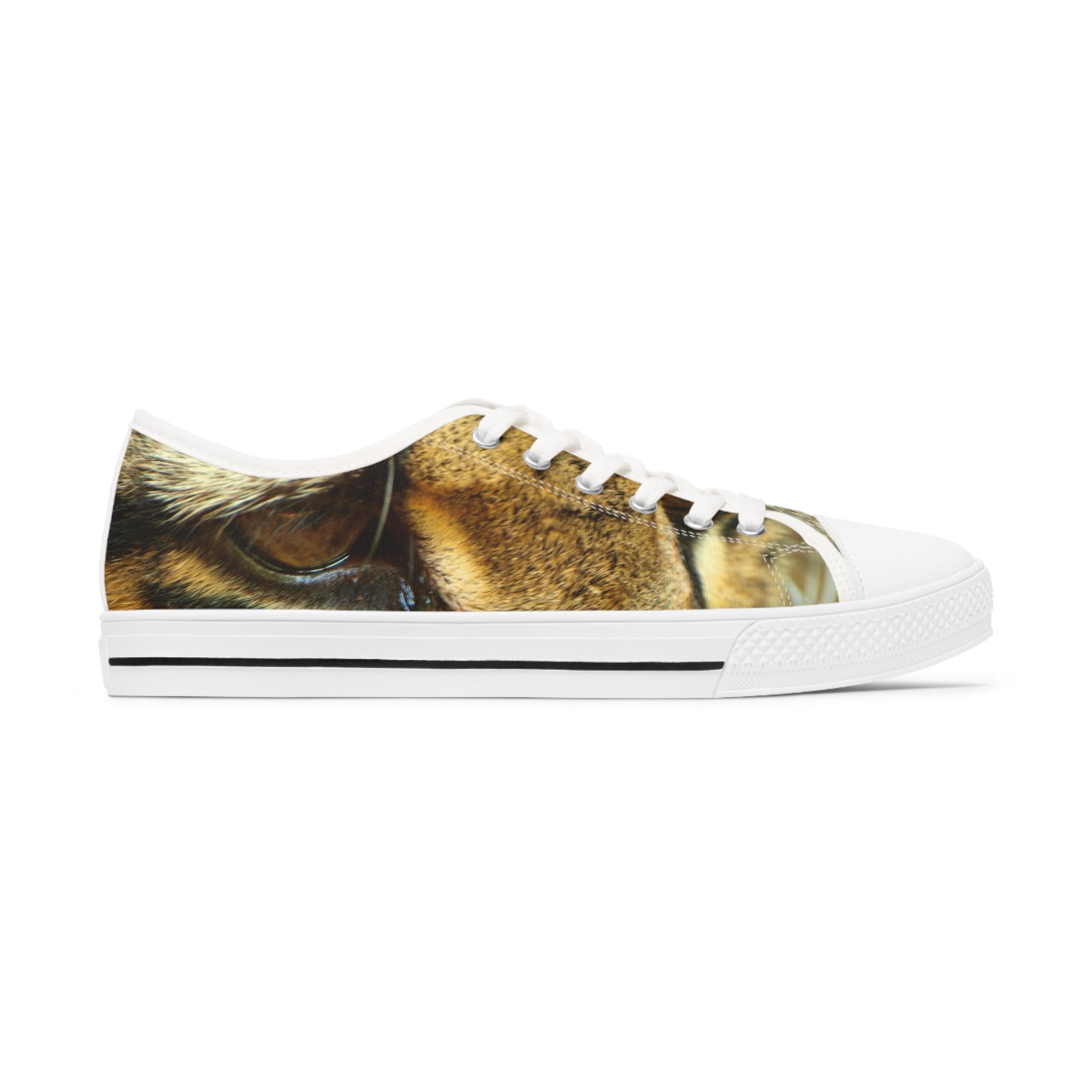 Ocelot Women's Low Top Sneakers in black and white with silver metal eyelets, showcasing breathable canvas and stylish design.