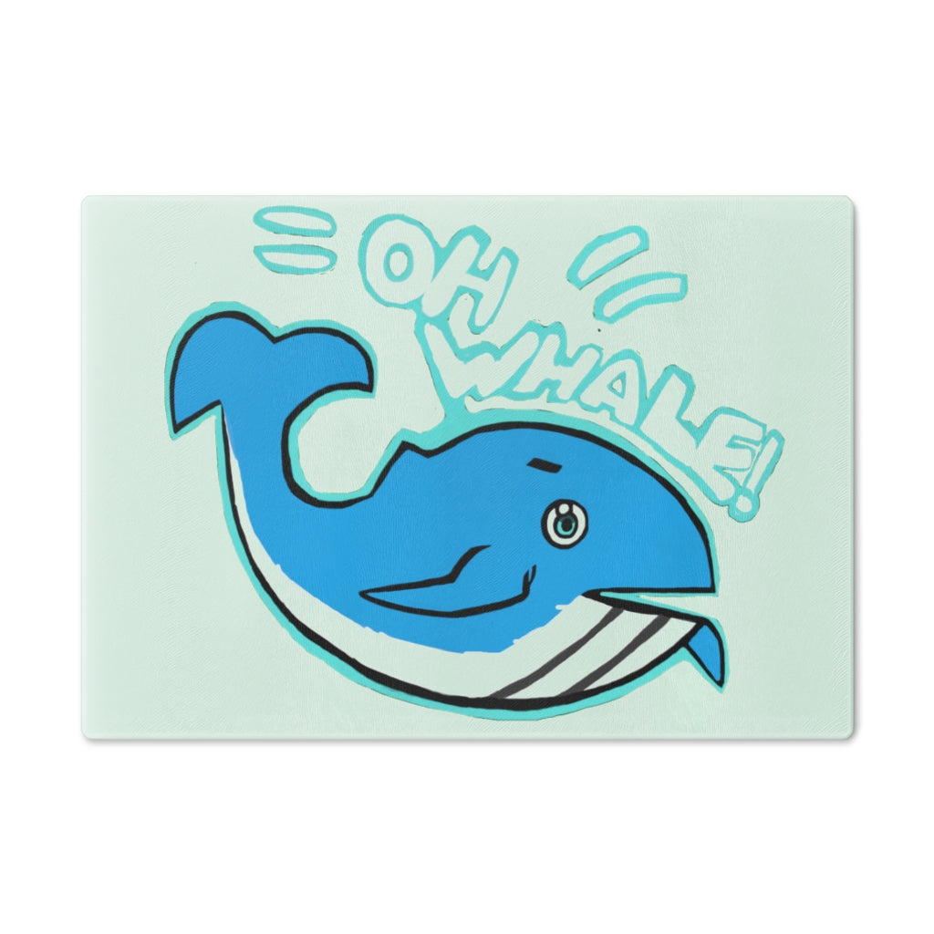 Oh Whale Cutting Board made of tempered glass with a charming whale design and rubber dots for stability.