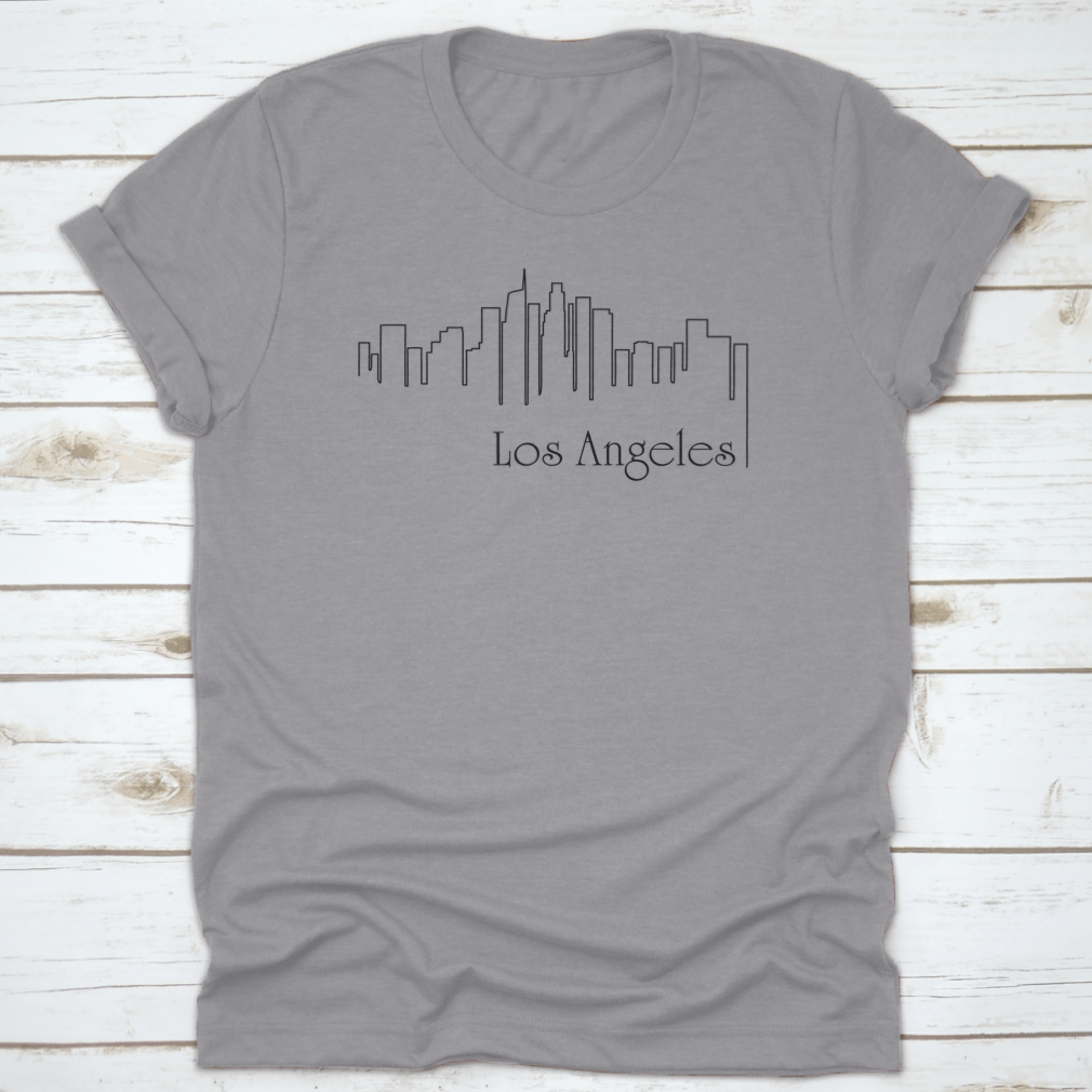 A stylish t-shirt featuring a one-line illustration of Los Angeles with an abstract background, showcasing a modern and artistic design.