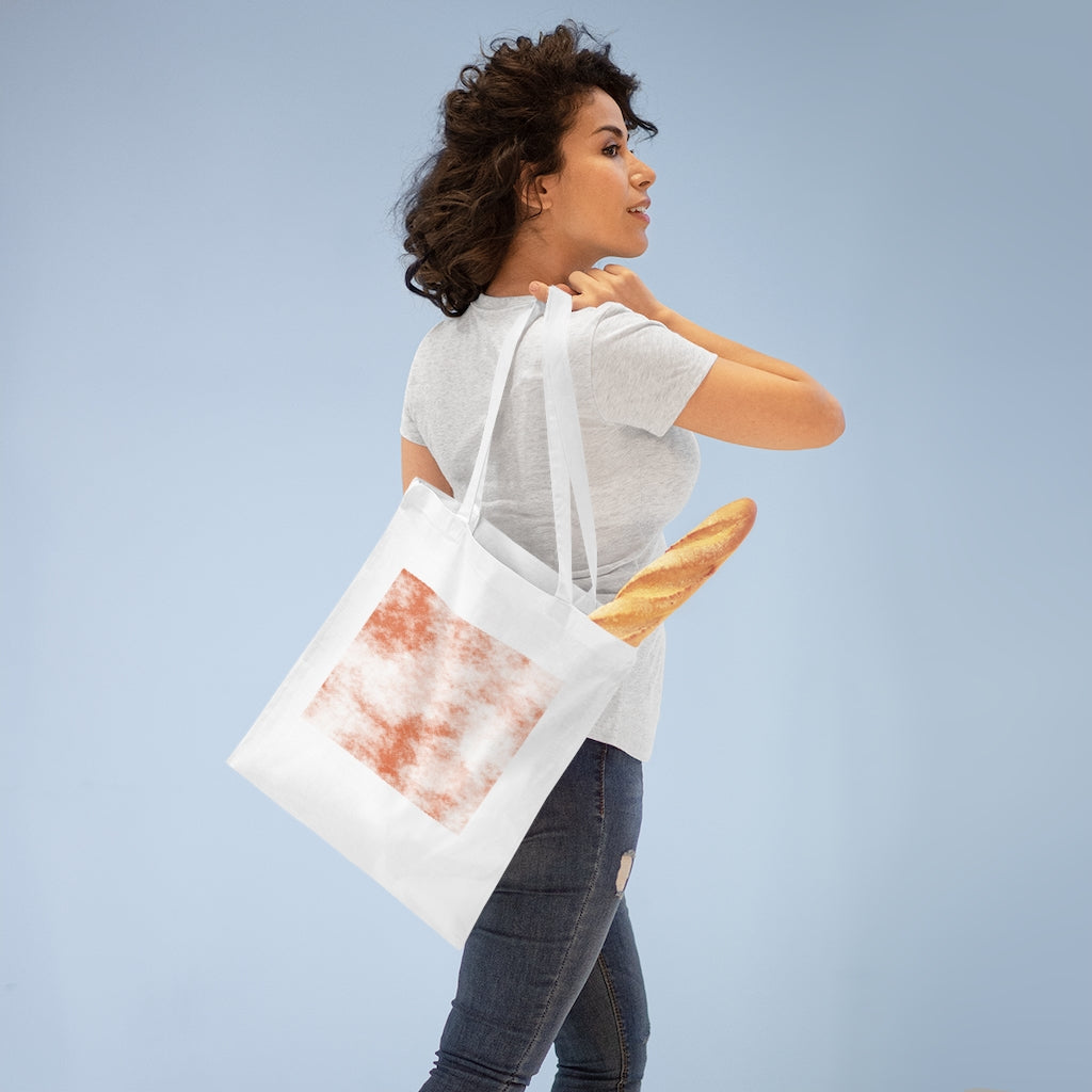 Orange Clouds Tote Bag featuring a vibrant cloud design and long cross-stitched handles, made from 100% cotton fabric.