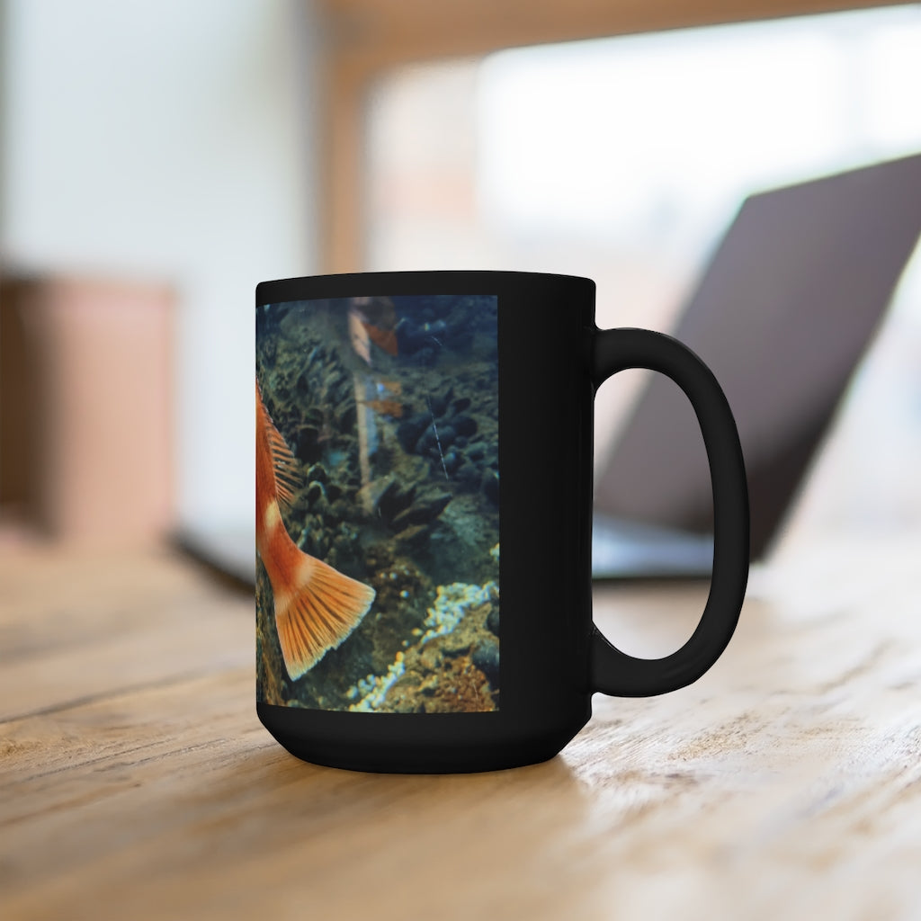 A stylish black ceramic mug with an orange fish design, holding 15 ounces of liquid, perfect for coffee and tea lovers.