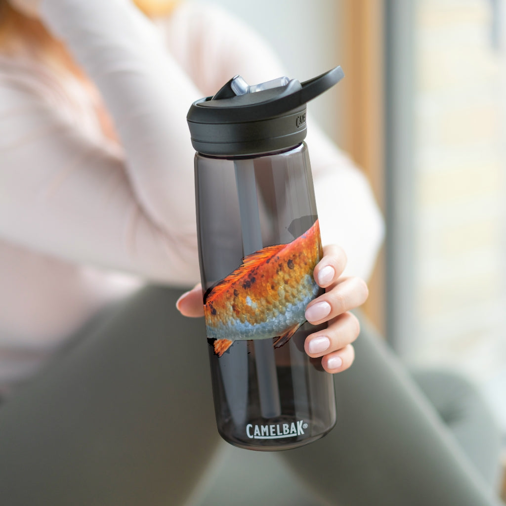 Orange Fish CamelBak Eddy® Water Bottle in 20oz and 25oz sizes, showcasing its robust design and spill-proof biting valve.