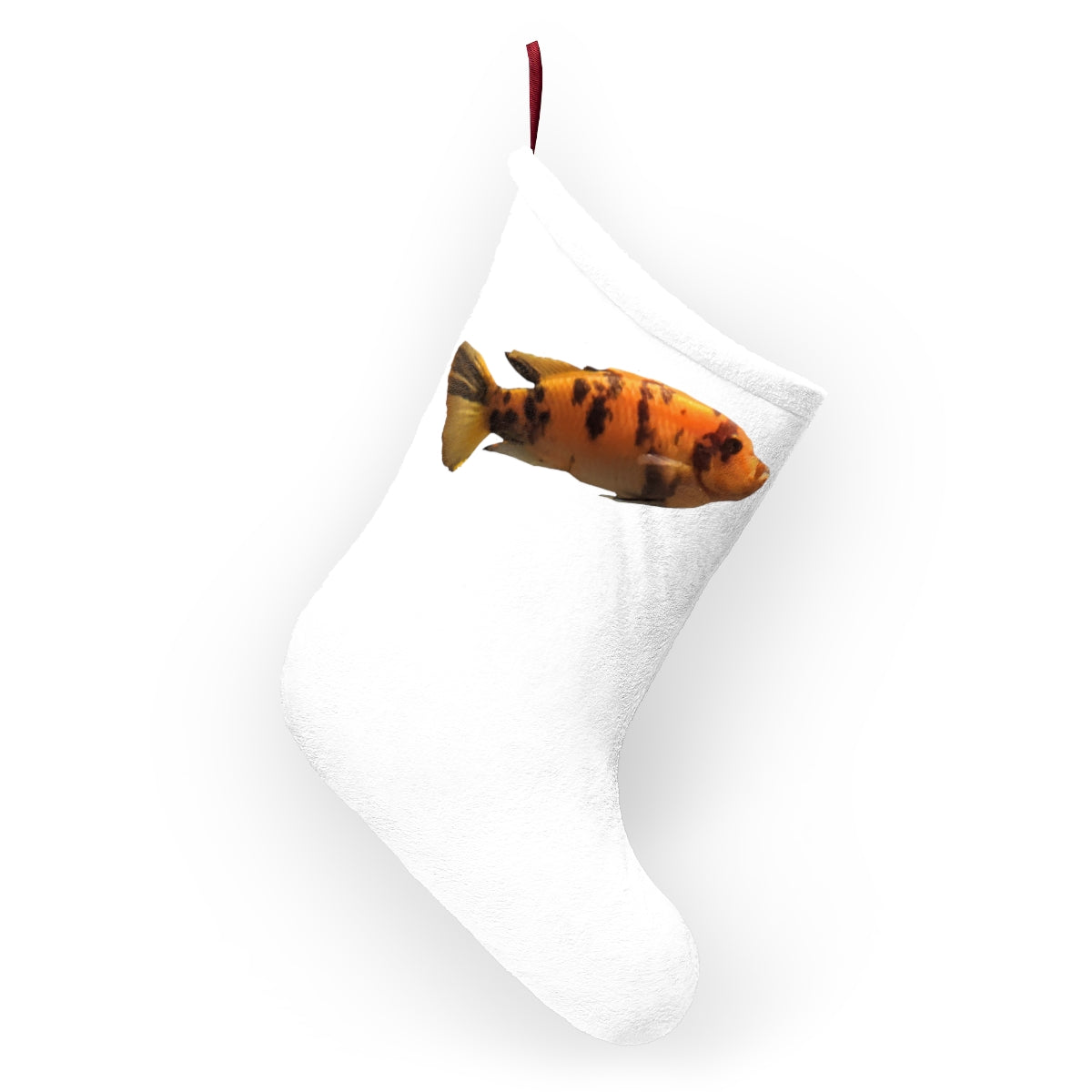 Vibrant orange fish Christmas stocking hanging by a fireplace, showcasing a festive design and personalized options.