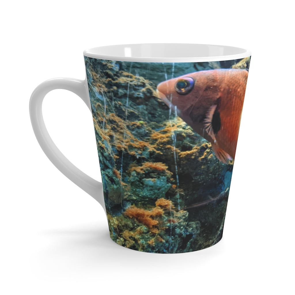 A vibrant orange fish latte mug made of durable white ceramic, featuring a comfortable C-handle and rounded corners.