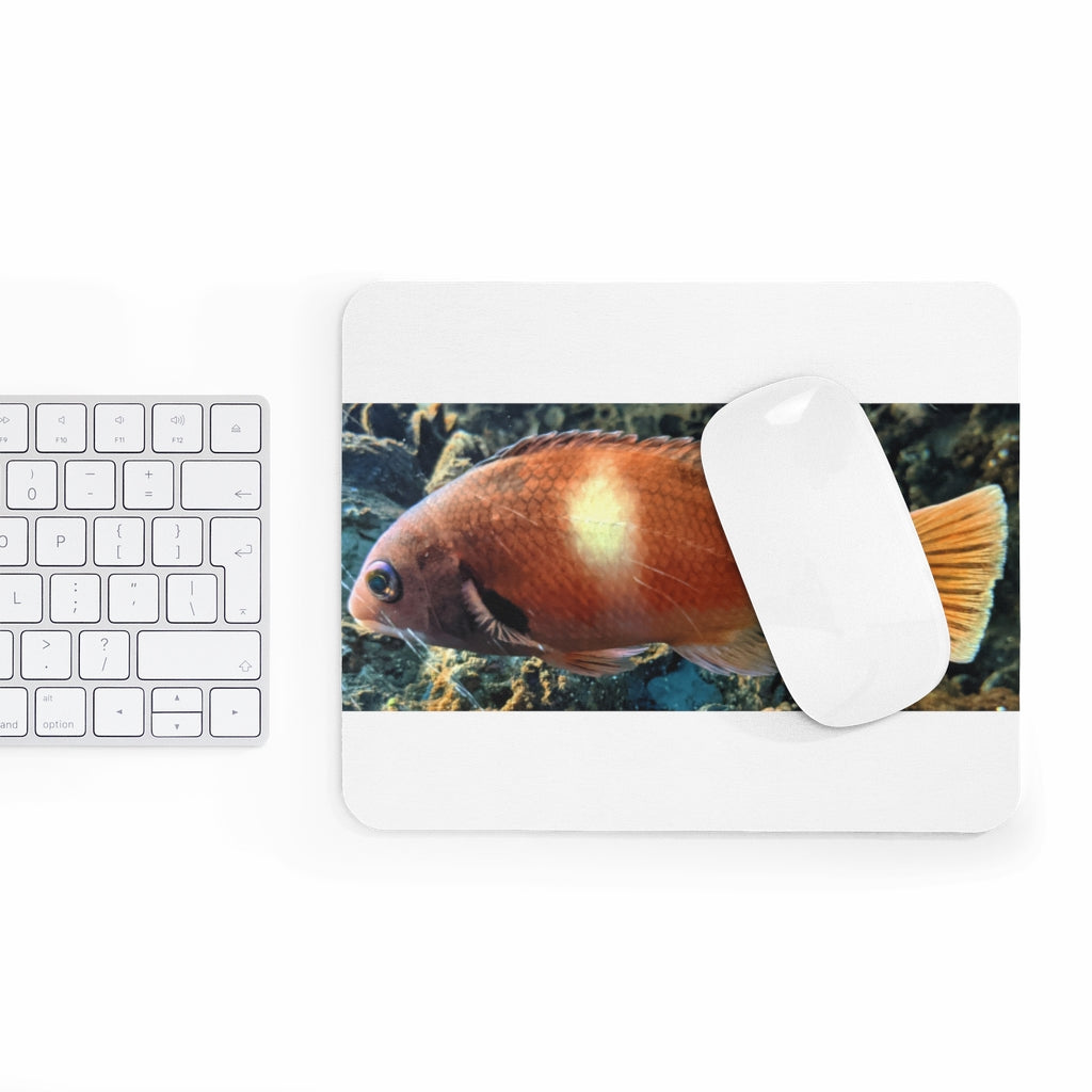 Orange Fish Mouse Pad featuring a vibrant fish design on a smooth neoprene surface, ideal for enhancing desk aesthetics.