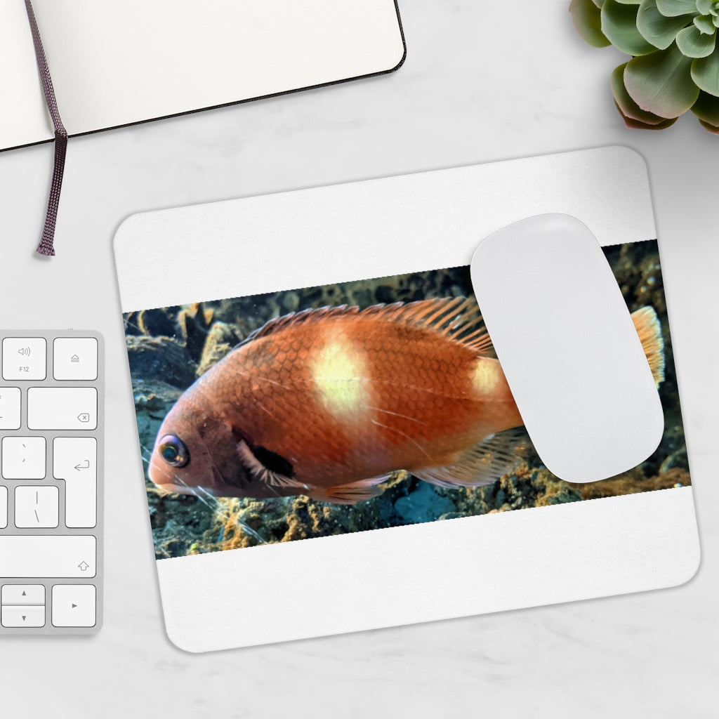 Orange Fish Mouse Pad featuring a vibrant fish design on a smooth neoprene surface, ideal for enhancing desk aesthetics.