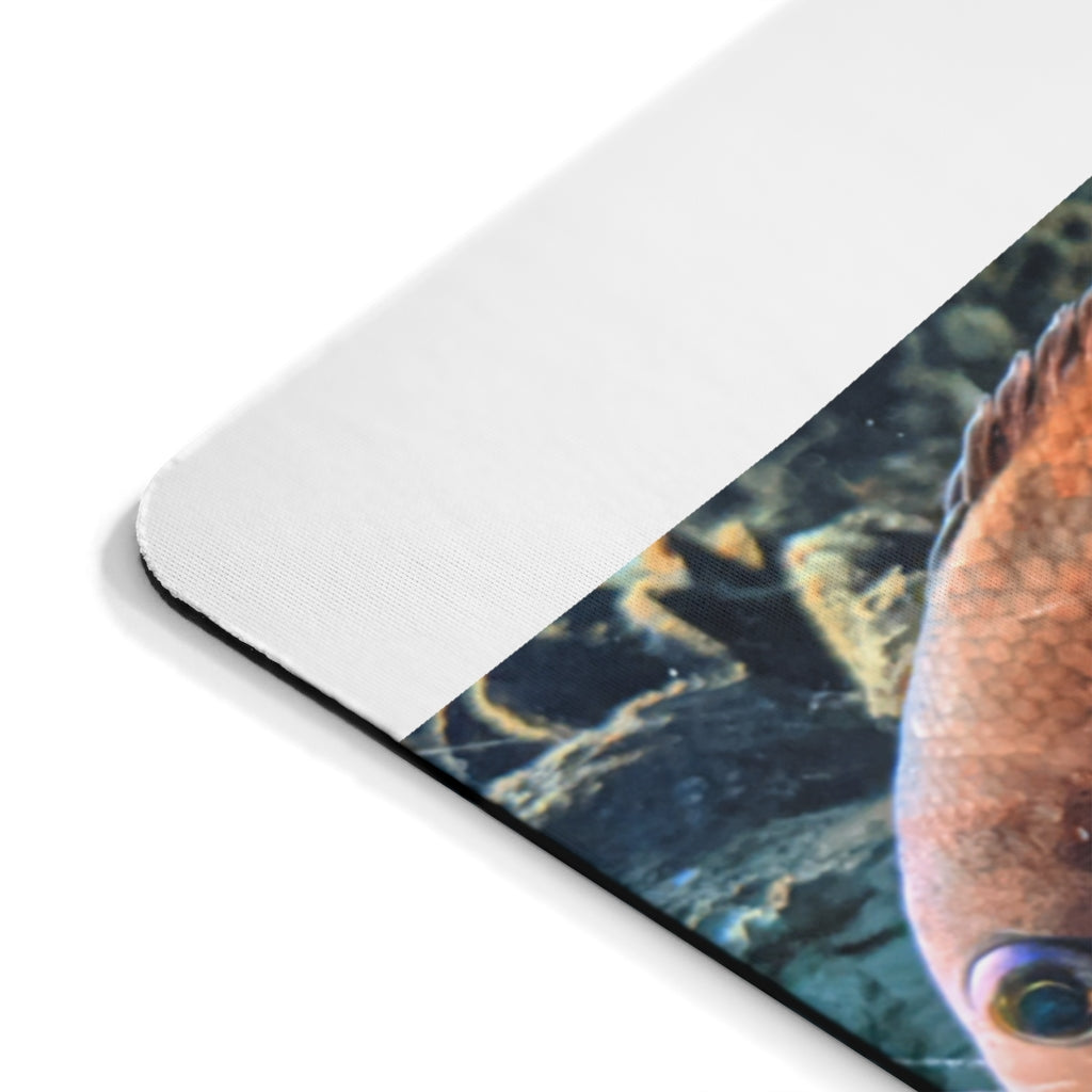 Orange Fish Mouse Pad featuring a vibrant fish design on a smooth neoprene surface, ideal for enhancing desk aesthetics.