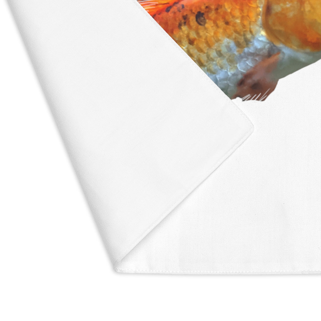 Orange Fish Placemat featuring a vibrant fish design on one side and natural cotton on the reverse, perfect for dining tables.