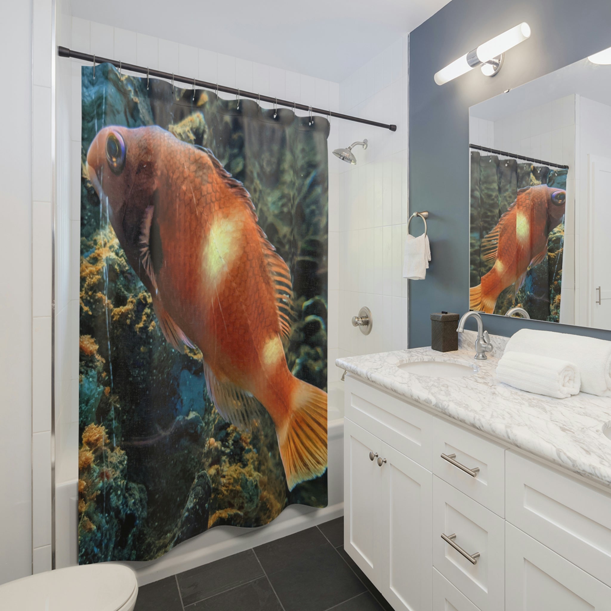 Vibrant orange fish shower curtain hanging in a bathroom, showcasing colorful aquatic design.