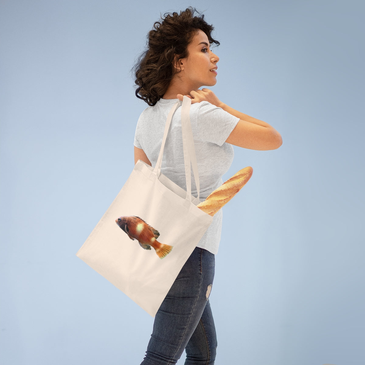 Orange Fish Tote Bag made of 100% cotton with cross-stitched handles, perfect for everyday use.