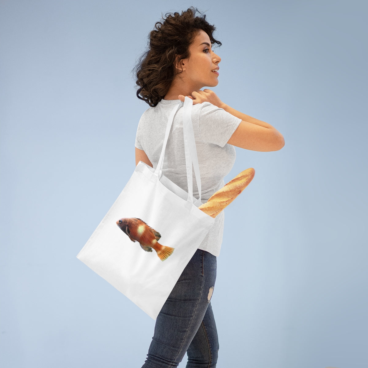 Orange Fish Tote Bag made of 100% cotton with cross-stitched handles, perfect for everyday use.