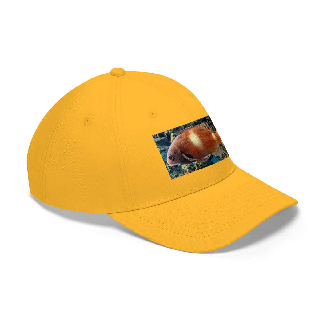 Orange Fish Unisex Twill Hat featuring a classic 6-panel design and adjustable Velcro closure, made from 100% cotton twill.