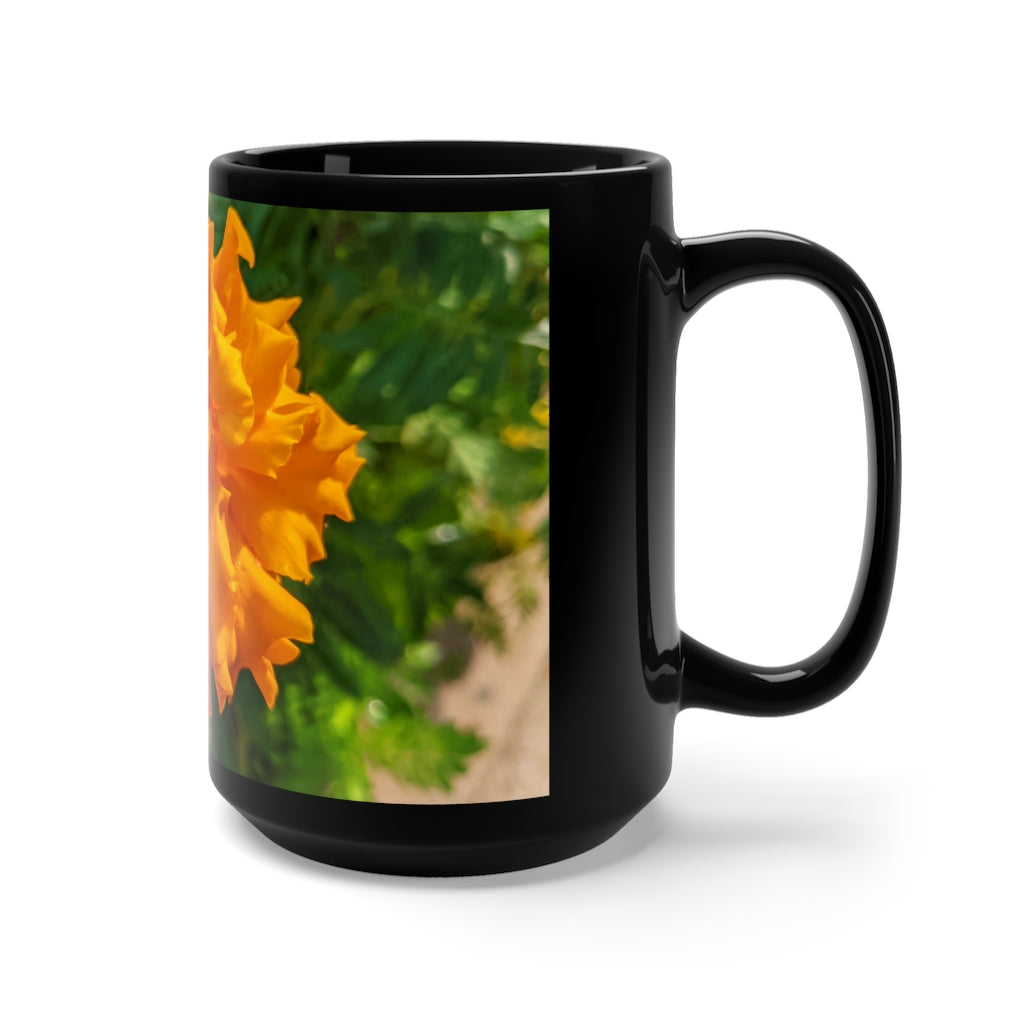 A stylish 15oz black ceramic mug featuring an orange flower design, perfect for coffee and tea lovers.