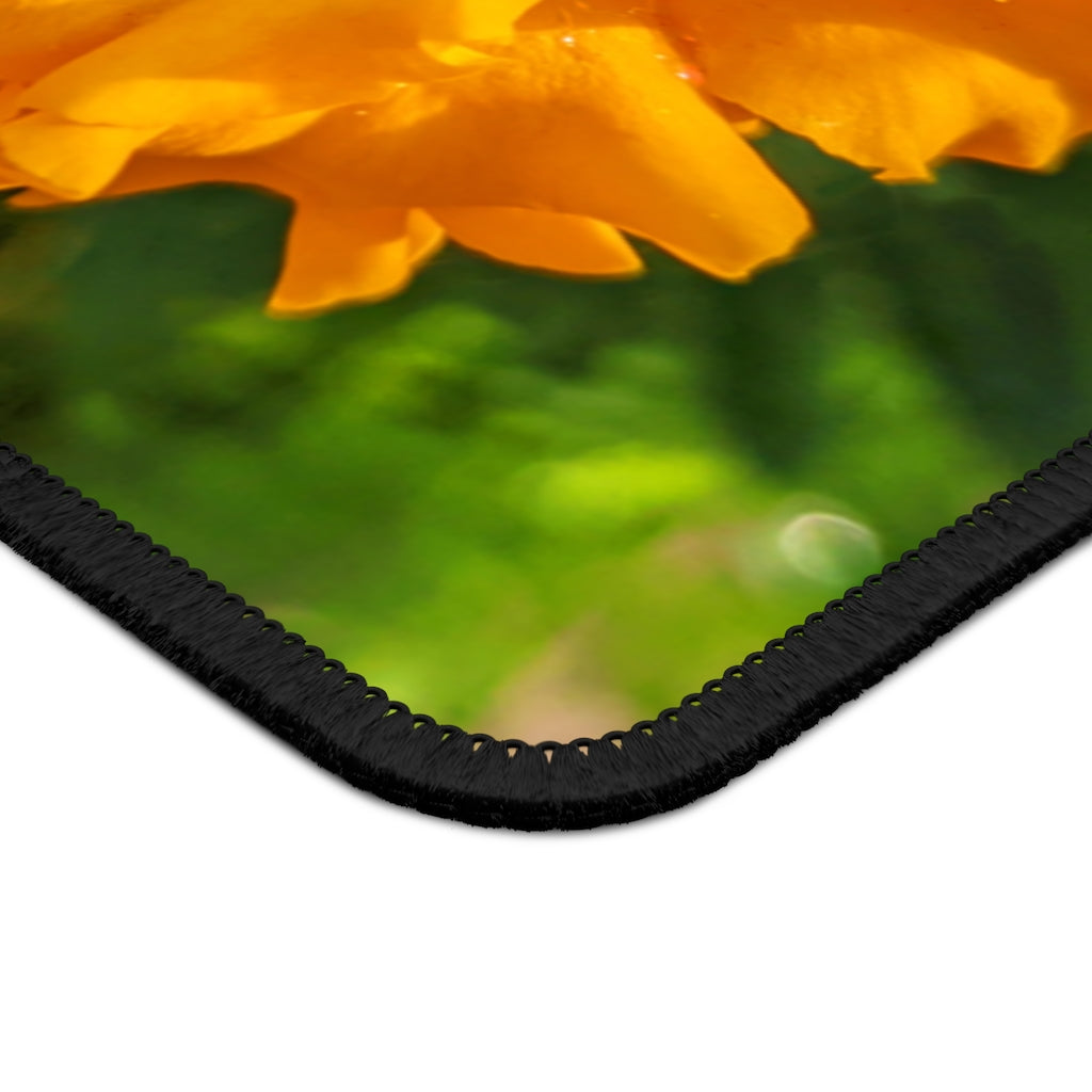 Orange Flower Gaming Mouse Pad featuring vibrant floral design and stitched edges, ideal for gaming and office use.