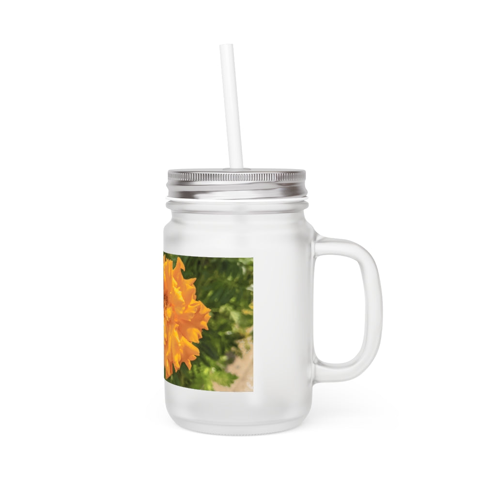 A stylish Orange Flower Mason Jar made of frosted glass, featuring a lid and straw, perfect for drinks.