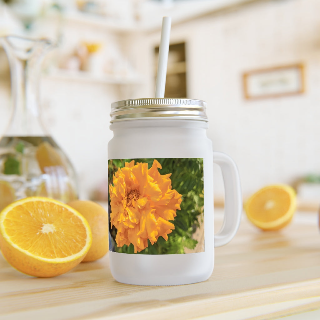 A stylish Orange Flower Mason Jar made of frosted glass, featuring a lid and straw, perfect for drinks.