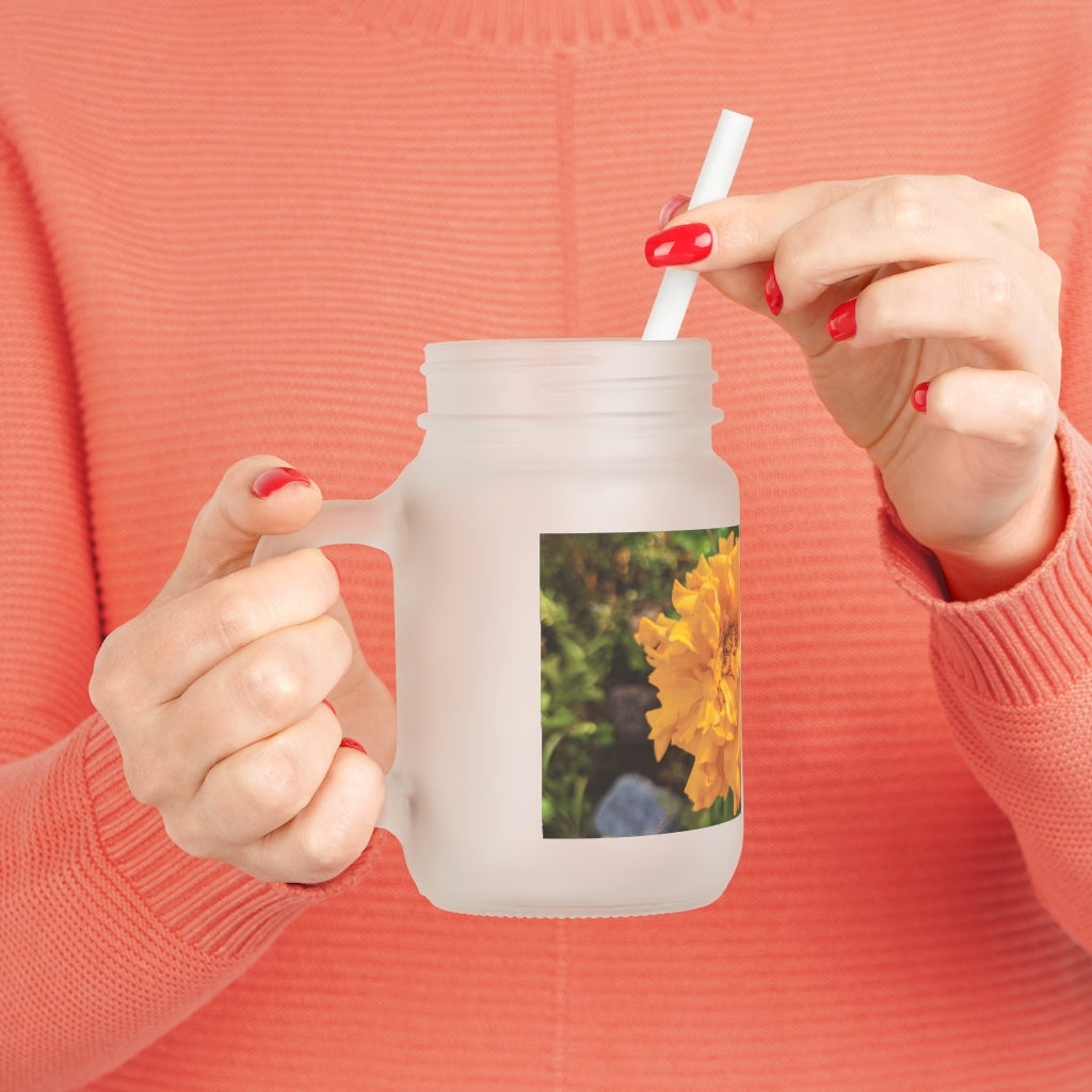 A stylish Orange Flower Mason Jar made of frosted glass, featuring a lid and straw, perfect for drinks.