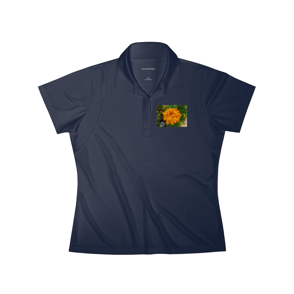 A stylish Orange Flower Women's Polo Shirt made from lightweight, snag-resistant fabric, featuring a tapered neck design.