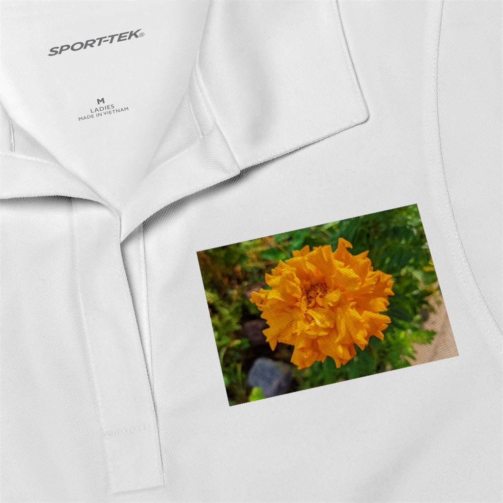 A stylish Orange Flower Women's Polo Shirt made from lightweight, snag-resistant fabric, featuring a tapered neck design.