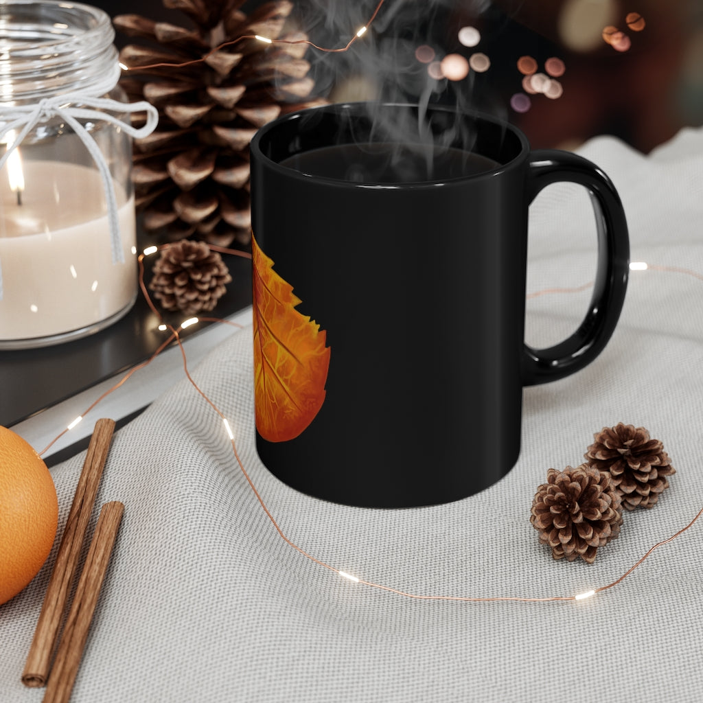 Orange Leaf 11oz black ceramic mug with a C-handle, perfect for coffee, tea, or hot chocolate.