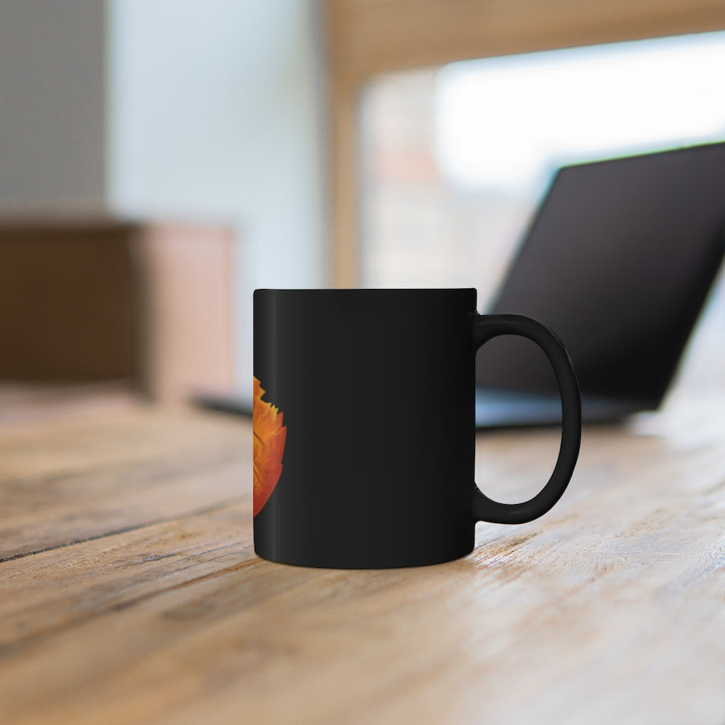 Orange Leaf 11oz black ceramic mug with a C-handle, perfect for coffee, tea, or hot chocolate.