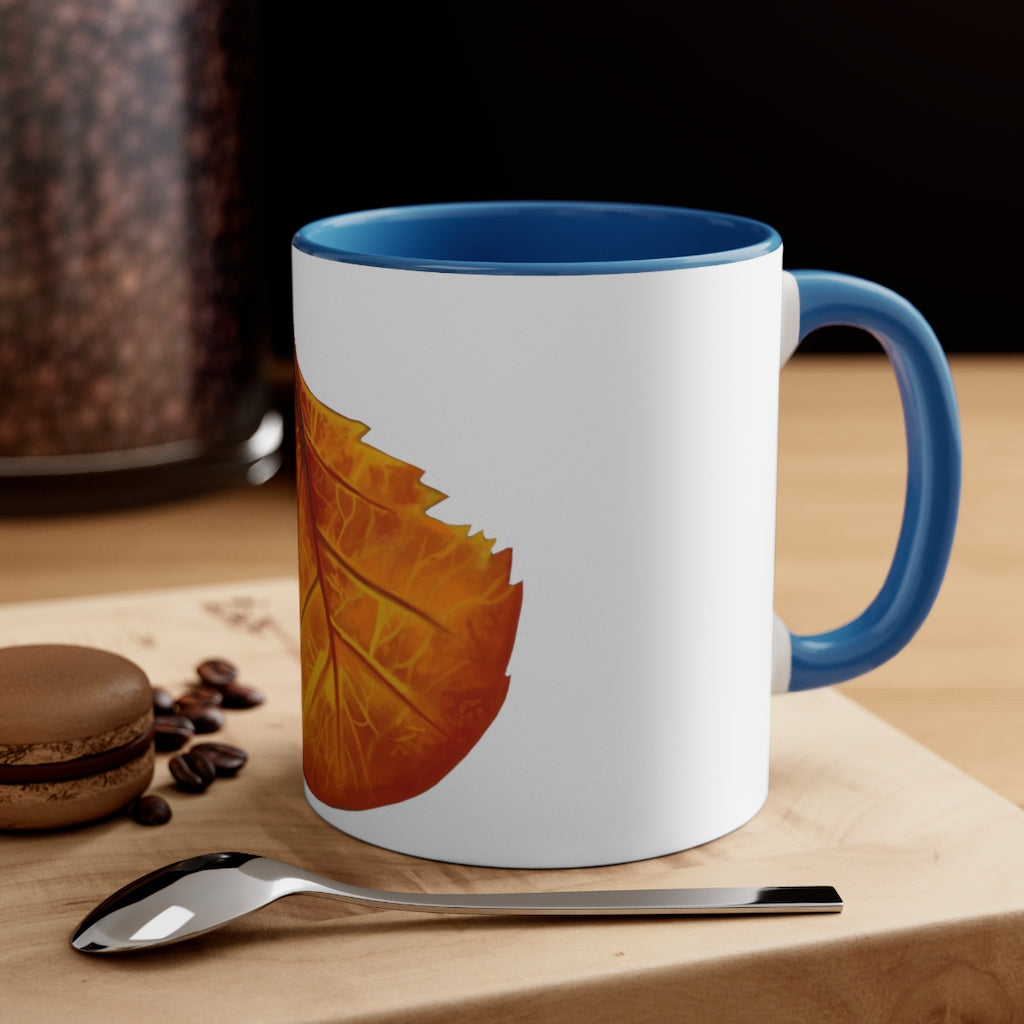 Orange Leaf Accent Coffee Mug with white ceramic exterior and vibrant orange interior and handle, showcasing a stylish two-tone design.