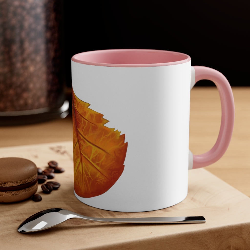 Orange Leaf Accent Coffee Mug with white ceramic exterior and vibrant orange interior and handle, showcasing a stylish two-tone design.