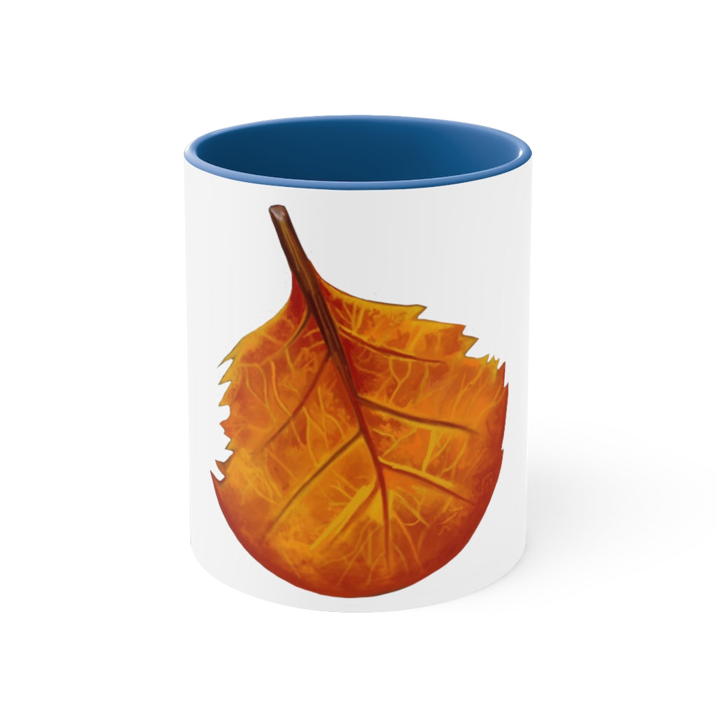 Orange Leaf Accent Coffee Mug with white ceramic exterior and vibrant orange interior and handle, showcasing a stylish two-tone design.