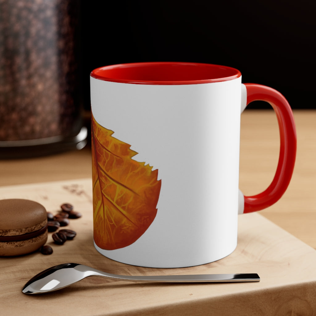 Orange Leaf Accent Coffee Mug with white ceramic exterior and vibrant orange interior and handle, showcasing a stylish two-tone design.