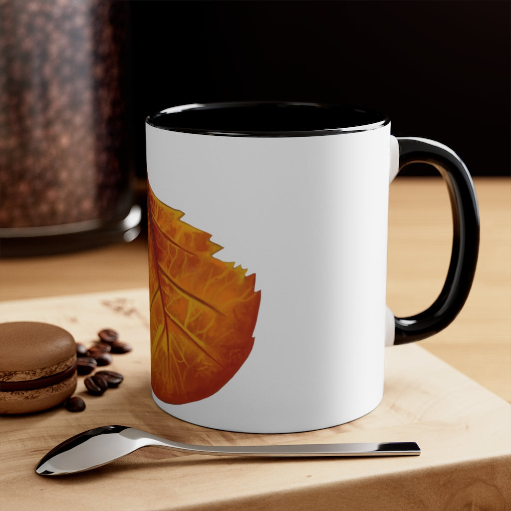 Orange Leaf Accent Coffee Mug with white ceramic exterior and vibrant orange interior and handle, showcasing a stylish two-tone design.