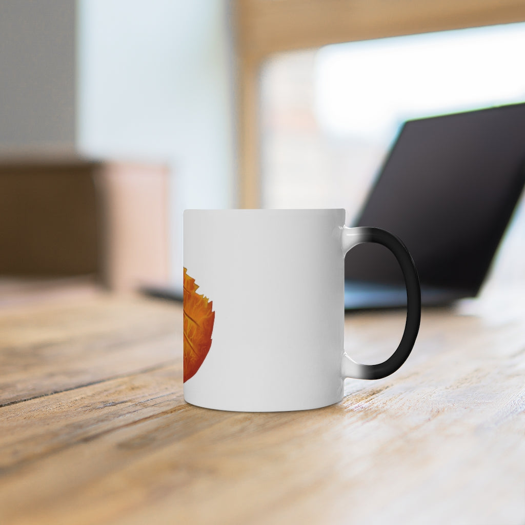 Orange Leaf Color Changing Mug displaying vibrant colors when filled with hot liquid, featuring a C-handle and rounded corners.