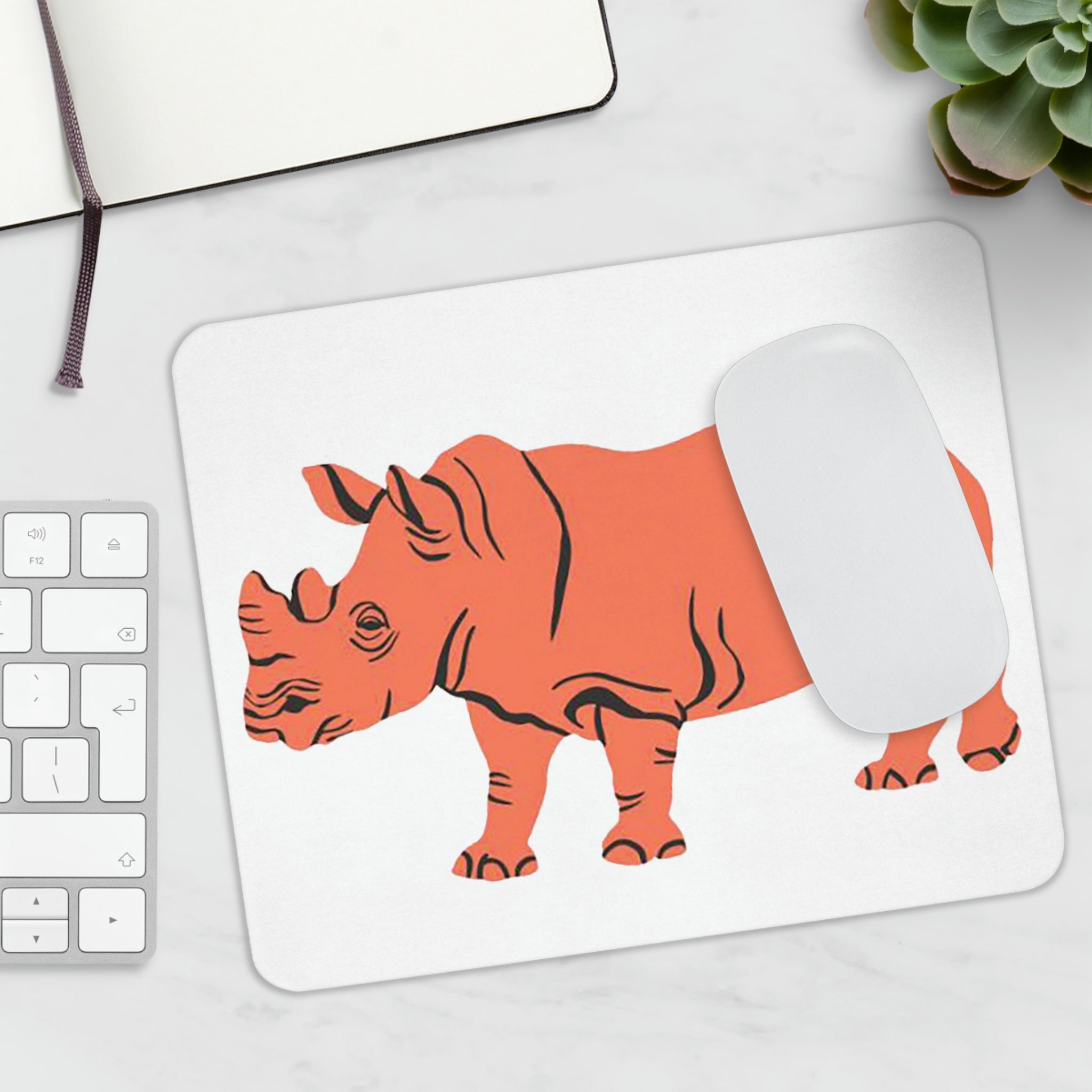 Orange Rhino Mouse Pad featuring a vibrant orange rhino design on a smooth surface with a non-slip rubber base.