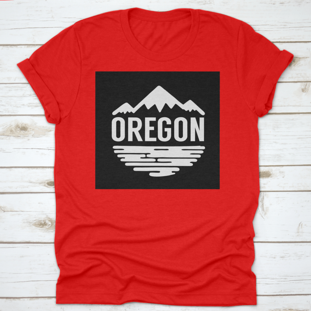 Cotton t-shirt featuring white silhouettes of mountains and water, representing Oregon's natural beauty.